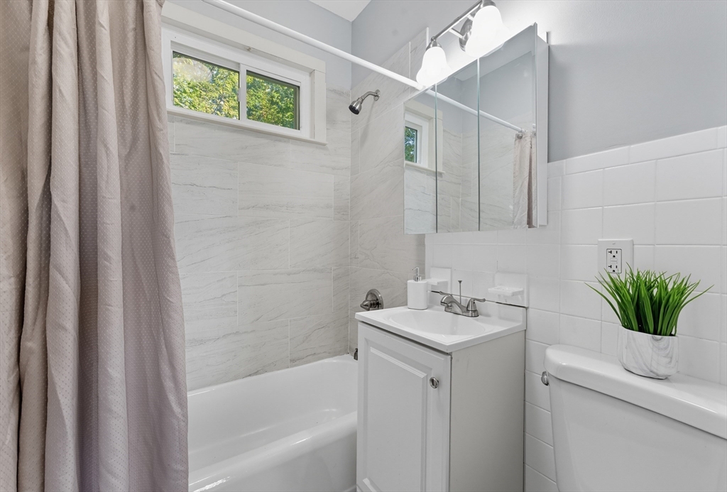 33 Taber Street Springfield, MA 01118 - Photo 18 of 39 a bathroom with a sink a bathtub and a shower