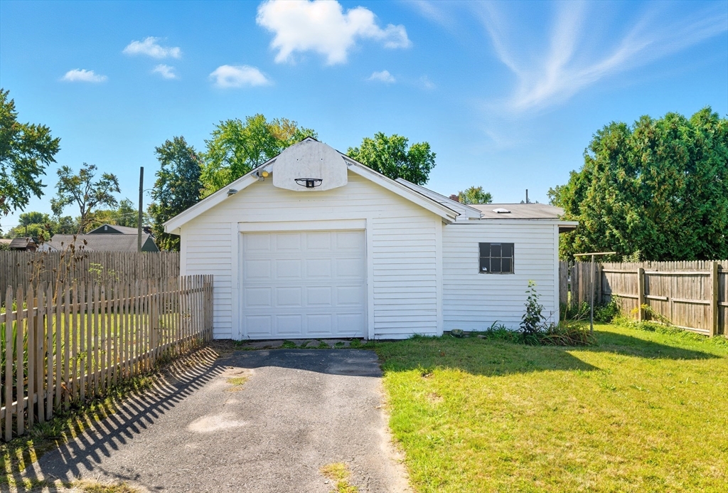 33 Taber Street Springfield, MA 01118 - Photo 2 of 39 a view of a backyard with a garden