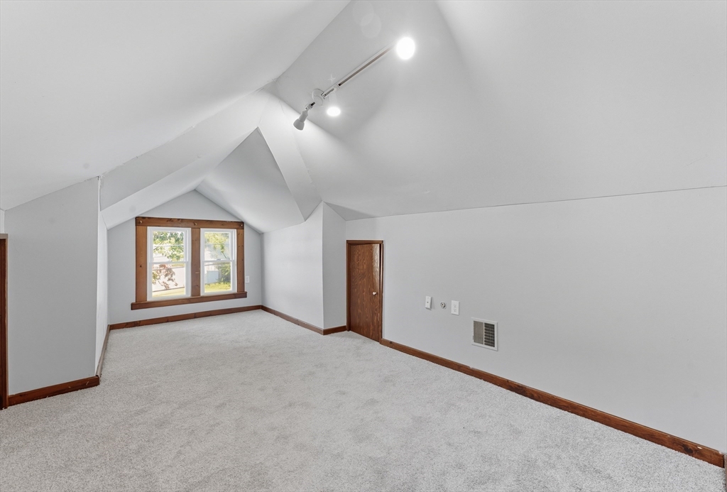 33 Taber Street Springfield, MA 01118 - Photo 23 of 39 an empty room with windows and fan