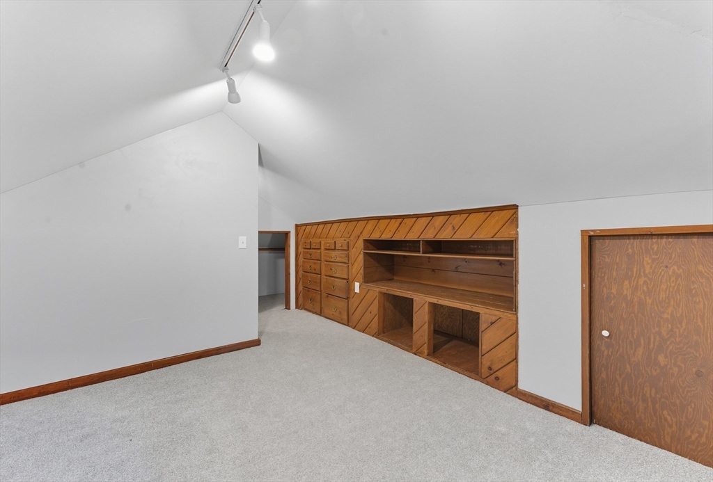 33 Taber Street Springfield, MA 01118 - Photo 25 of 39 a view of an empty room with a fireplace and a window