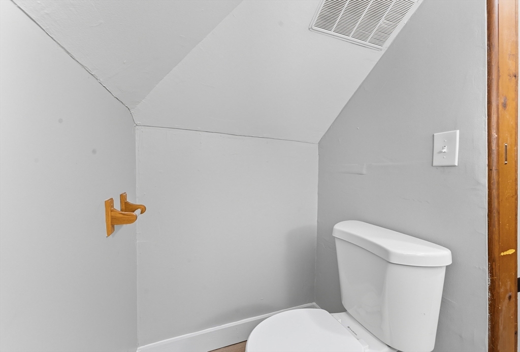 33 Taber Street Springfield, MA 01118 - Photo 26 of 39 a white toilet sitting next to a shower