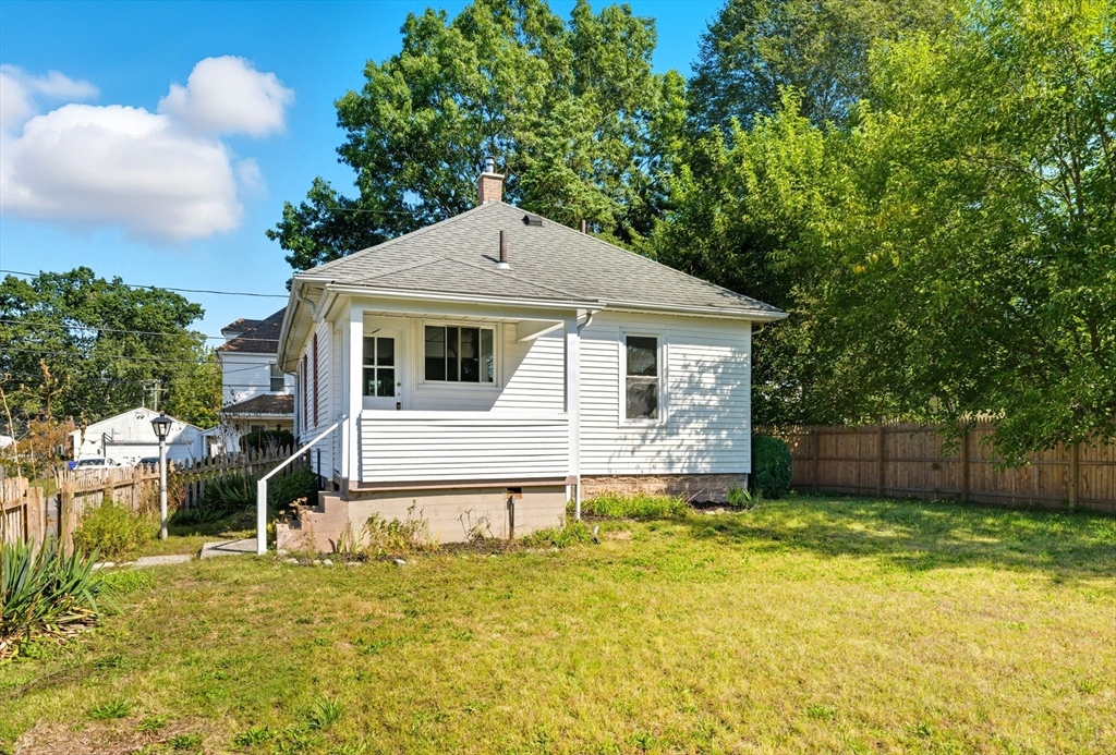 33 Taber Street Springfield, MA 01118 - Photo 32 of 39 a front view of a house with a yard