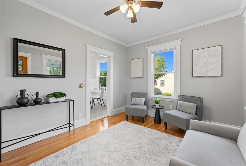 33 Taber Street Springfield, MA 01118 - Photo 4 of 39 a living room with furniture and a flat screen tv