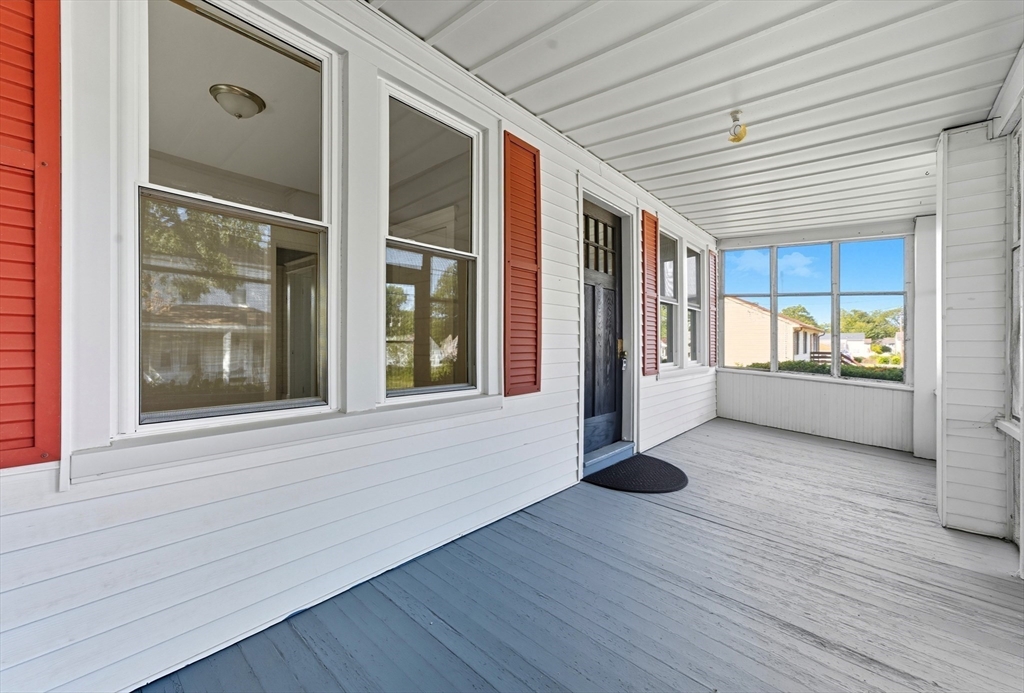 33 Taber Street Springfield, MA 01118 - Photo 5 of 39 a view of an empty room with a window and wooden floor