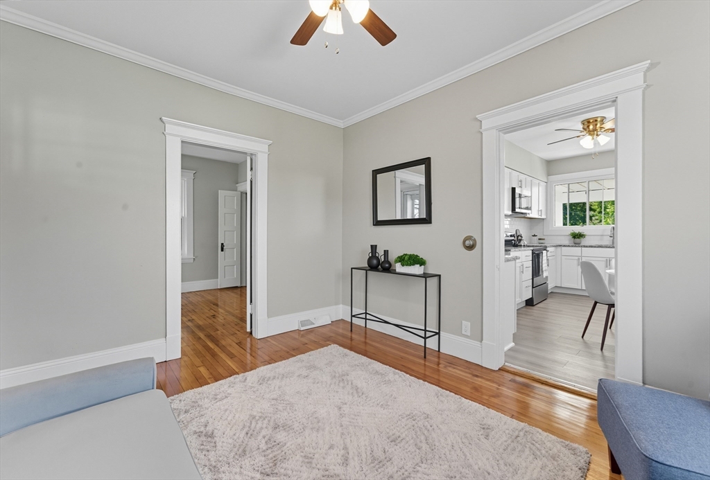 33 Taber Street Springfield, MA 01118 - Photo 8 of 39 a living room with furniture and a chandelier