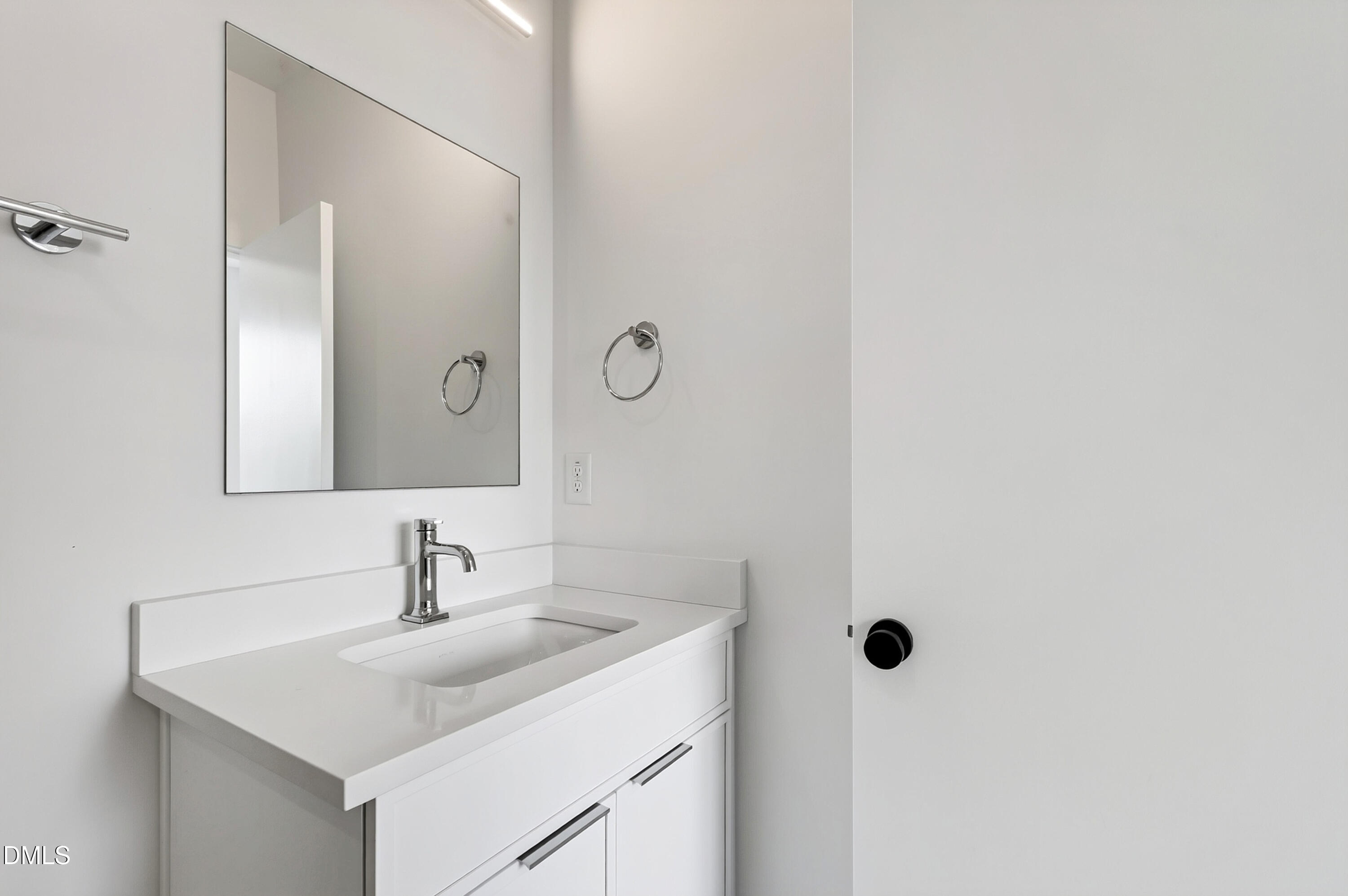 1317 Garner Road, Unit 102 Raleigh, NC 27610 - Photo 38 of 44 a bathroom with a sink and a mirror