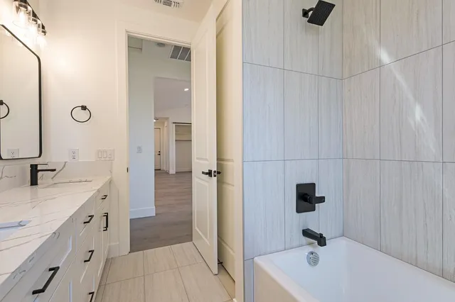 a bathroom with a sink and a tub