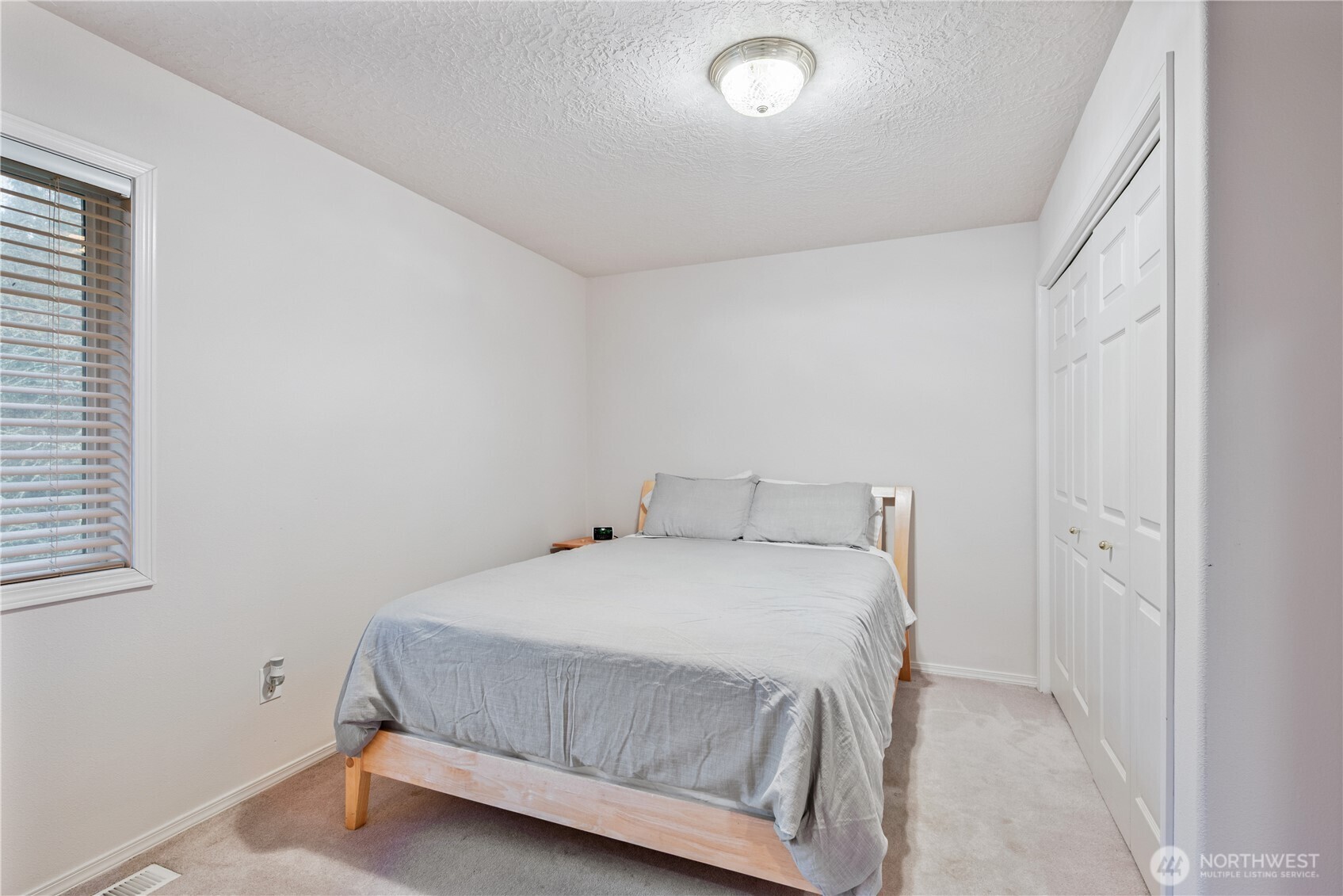 214 St James Court Longview, WA 98632 - Photo 16 of 40 a bedroom with a bed and a window