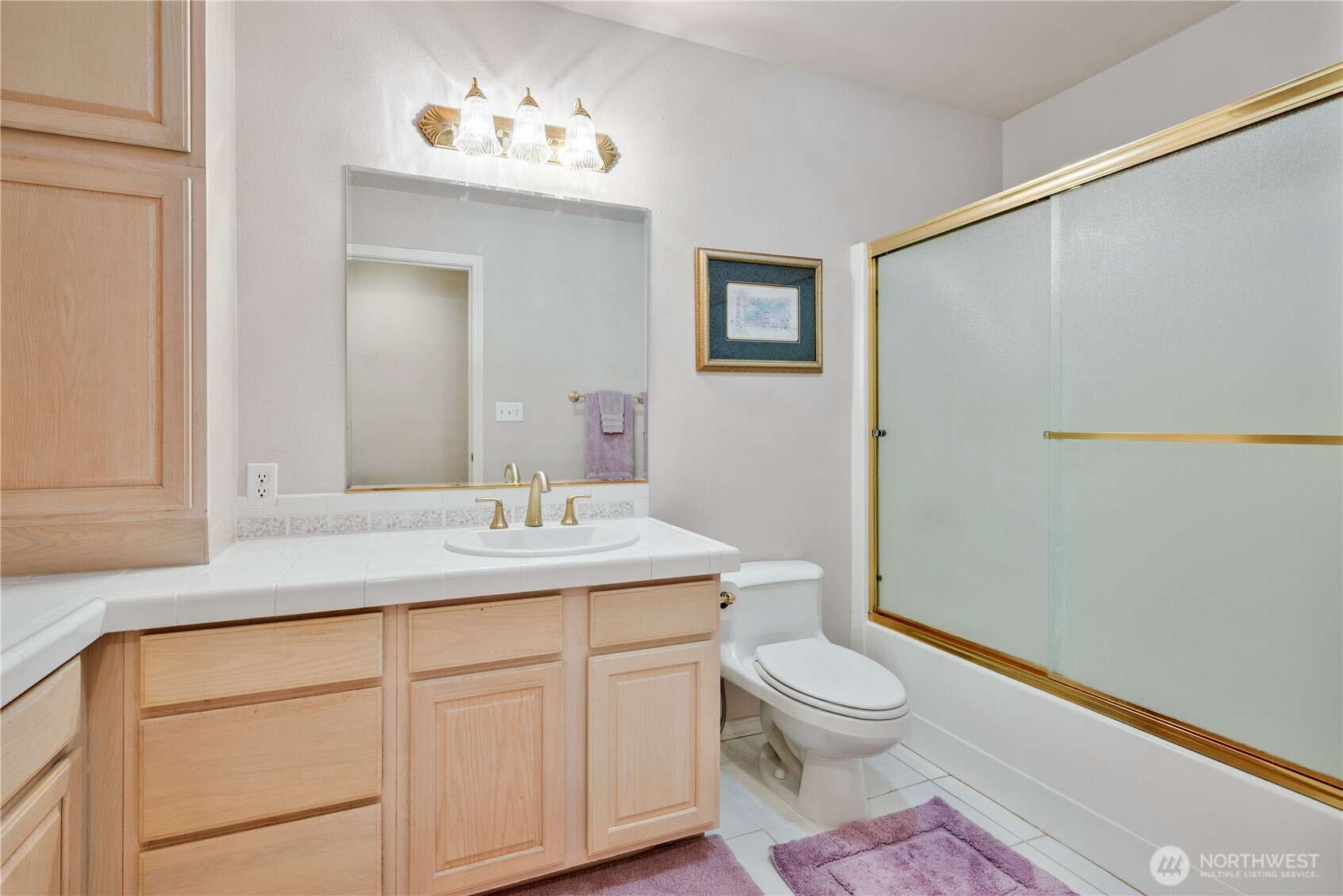 214 St James Court Longview, WA 98632 - Photo 18 of 40 a bathroom with a granite countertop sink a toilet and a mirror