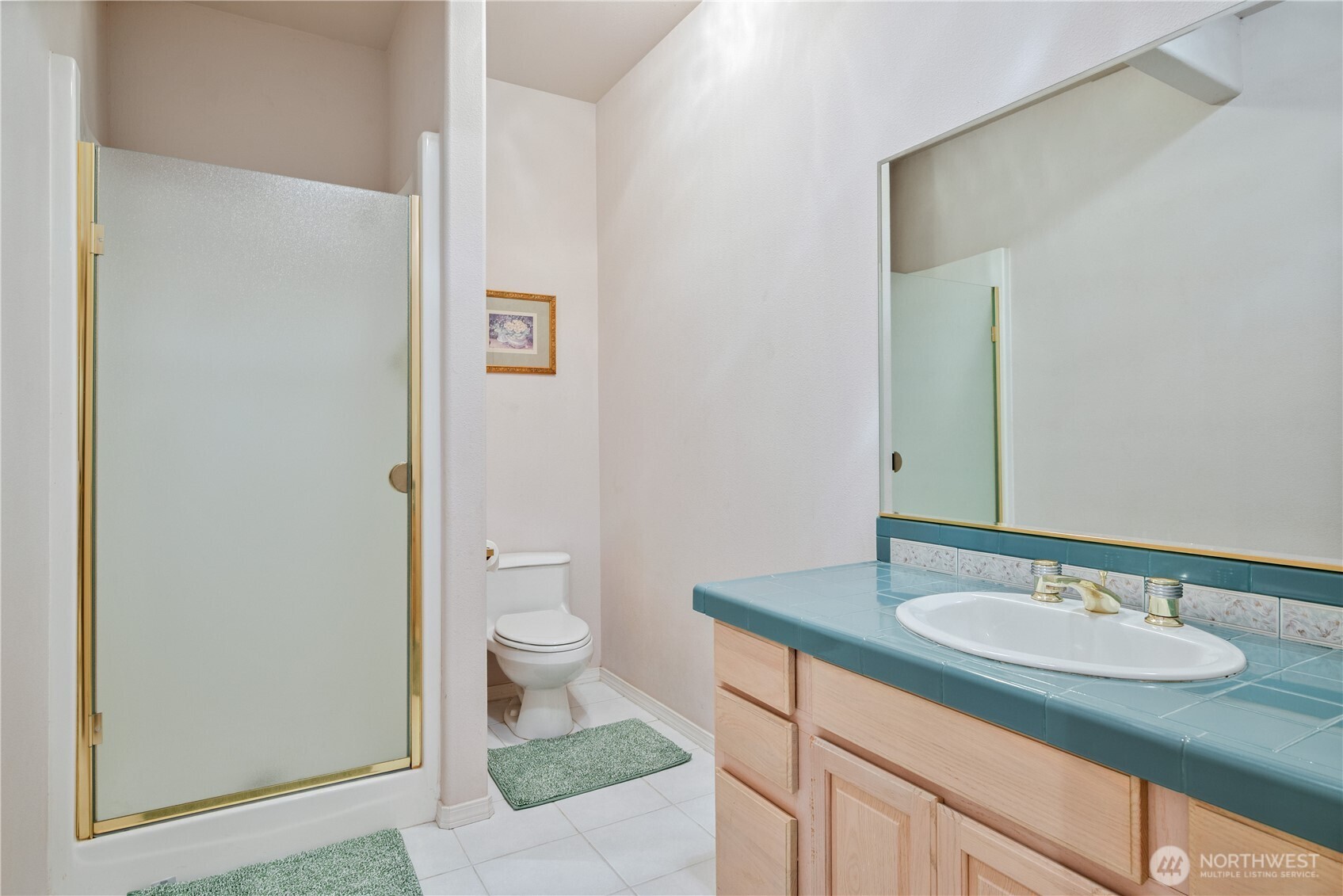214 St James Court Longview, WA 98632 - Photo 26 of 40 a bathroom with a granite countertop sink toilet and a mirror