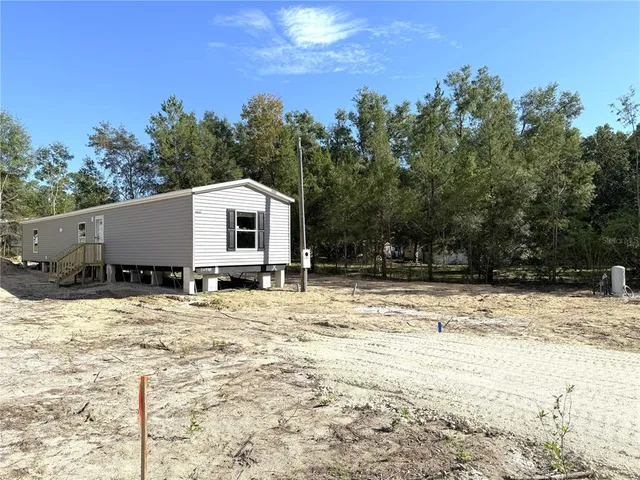 a house with trees in the background