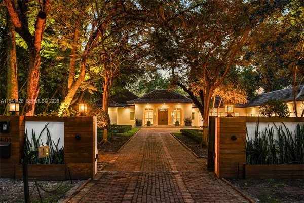 a living room with furniture a chandelier and a chandelier