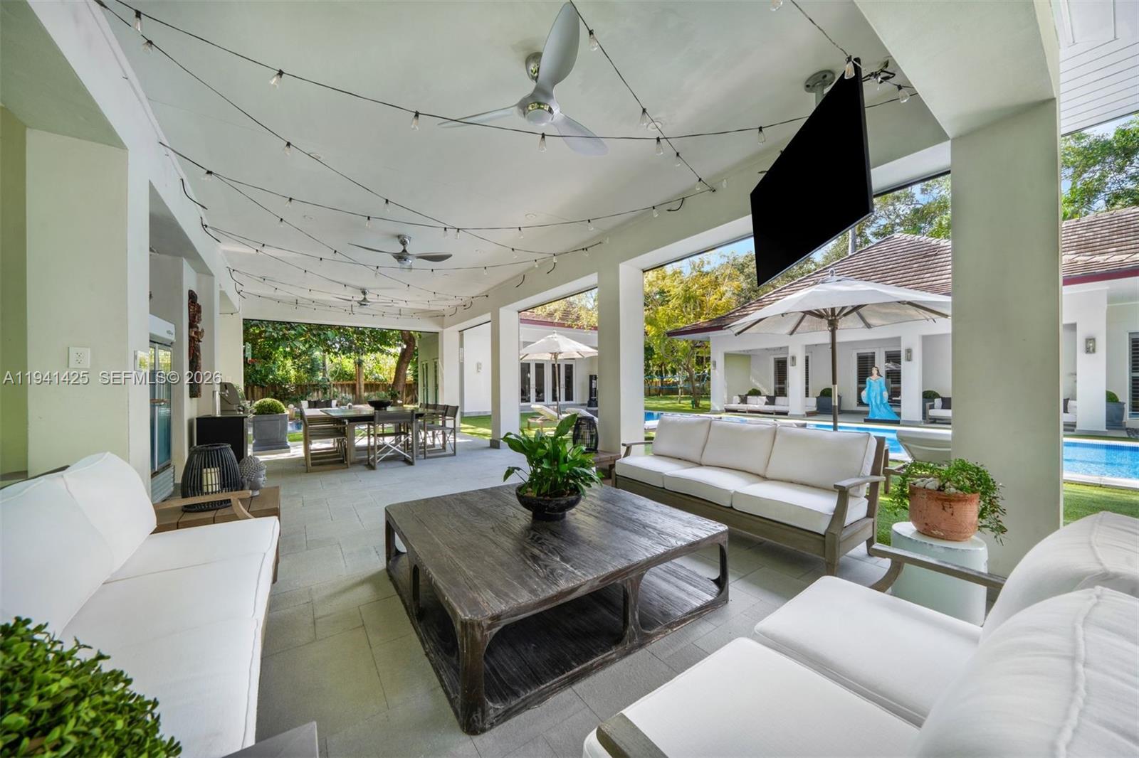 4100 Kiaora Street Miami, FL 33133 - Photo 12 of 26 a living room with furniture and a large window