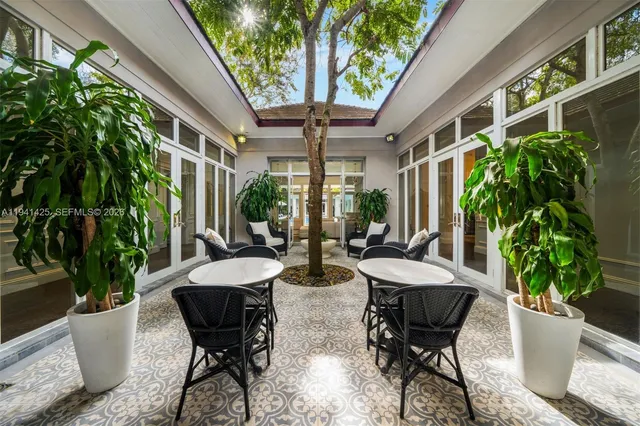 a view of an outdoor space with furniture and garden
