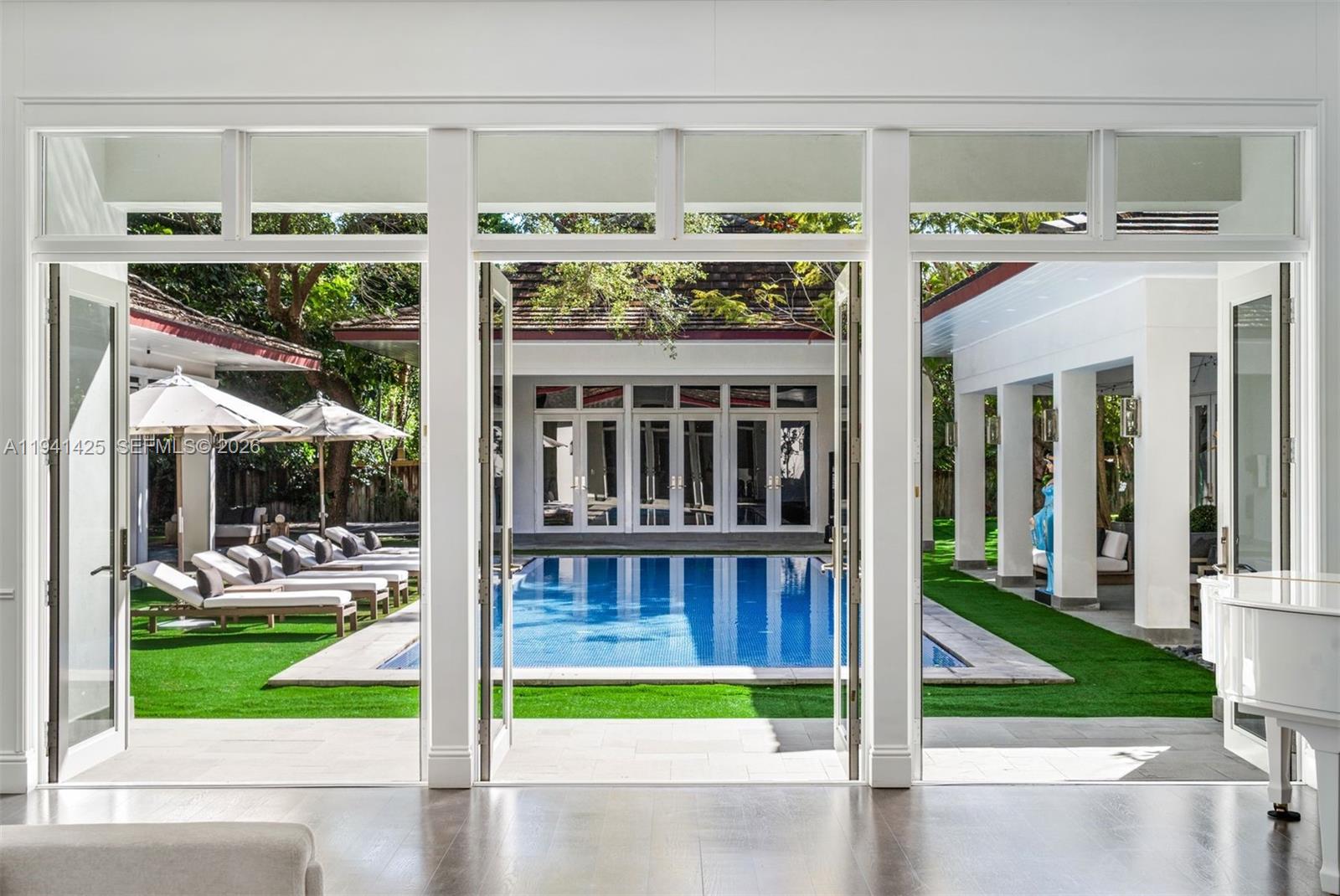 4100 Kiaora Street Miami, FL 33133 - Photo 15 of 26 a view of a porch with furniture and garden