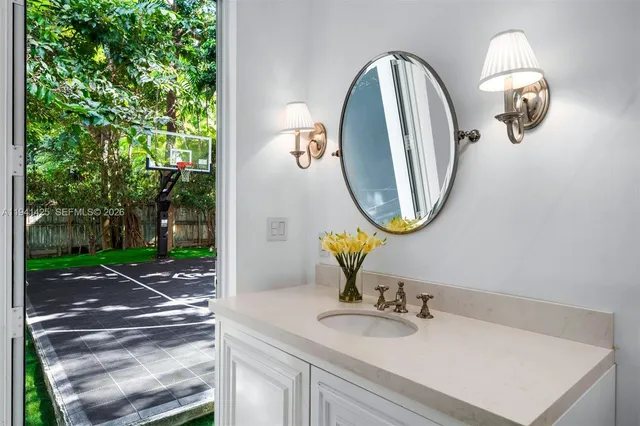 a bathroom with a sink and a mirror