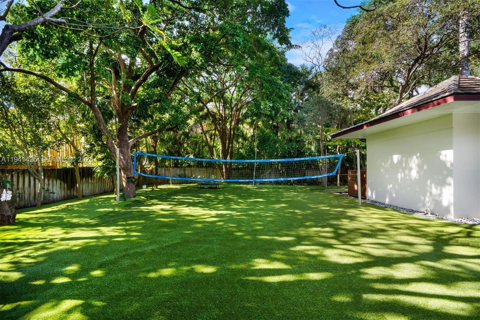 4100 Kiaora Street Miami, FL 33133 - Photo 21 of 26 a backyard of a house with lots of green space
