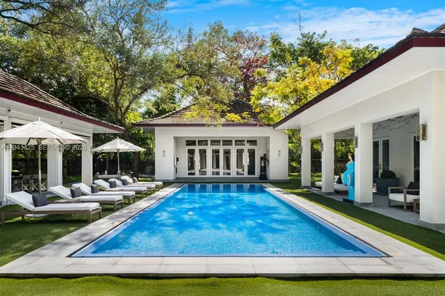 a view of swimming pool with outdoor seating