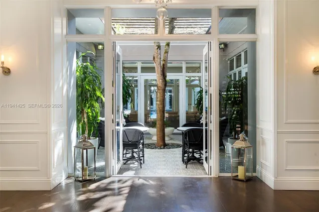 a living room with hardwood floor and windows