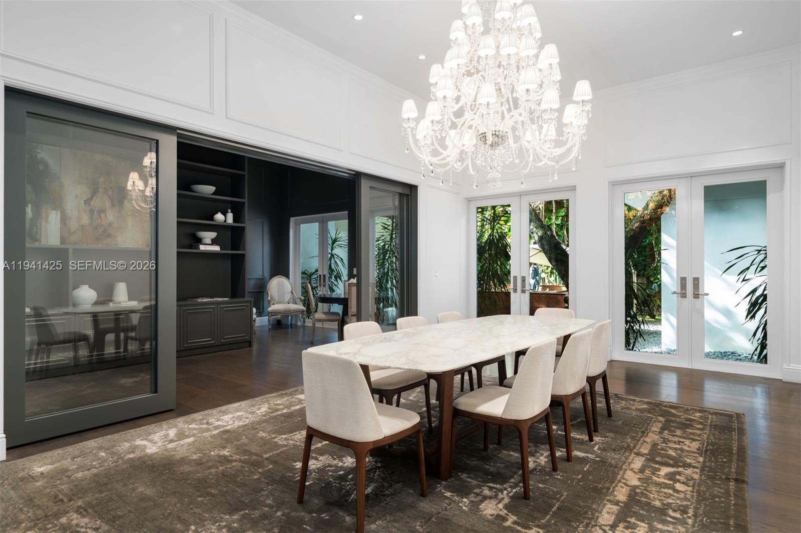 4100 Kiaora Street Miami, FL 33133 - Photo 5 of 26 a view of a dining room with furniture window and wooden floor