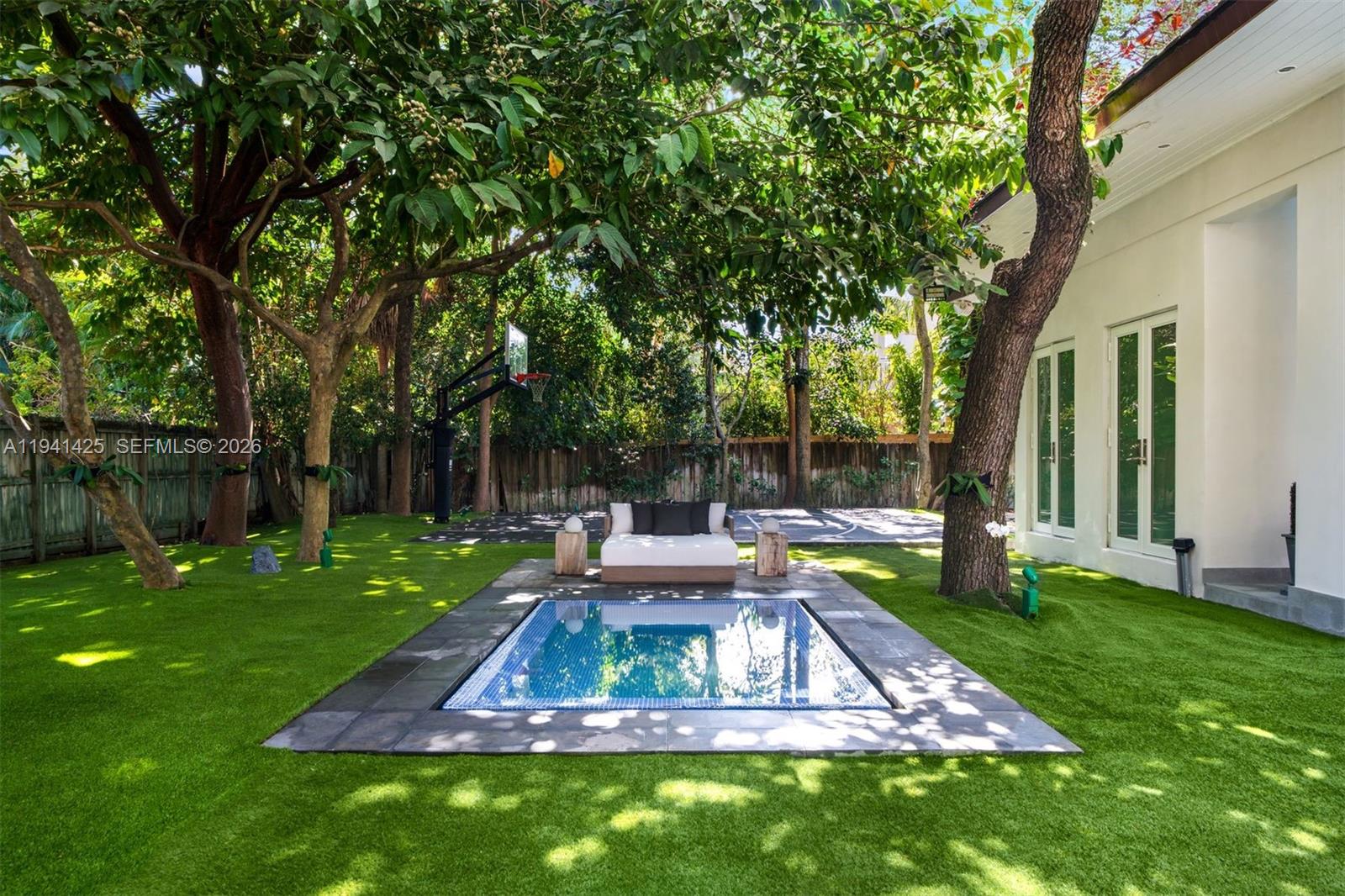 4100 Kiaora Street Miami, FL 33133 - Photo 10 of 26 a view of a chair and table in the garden