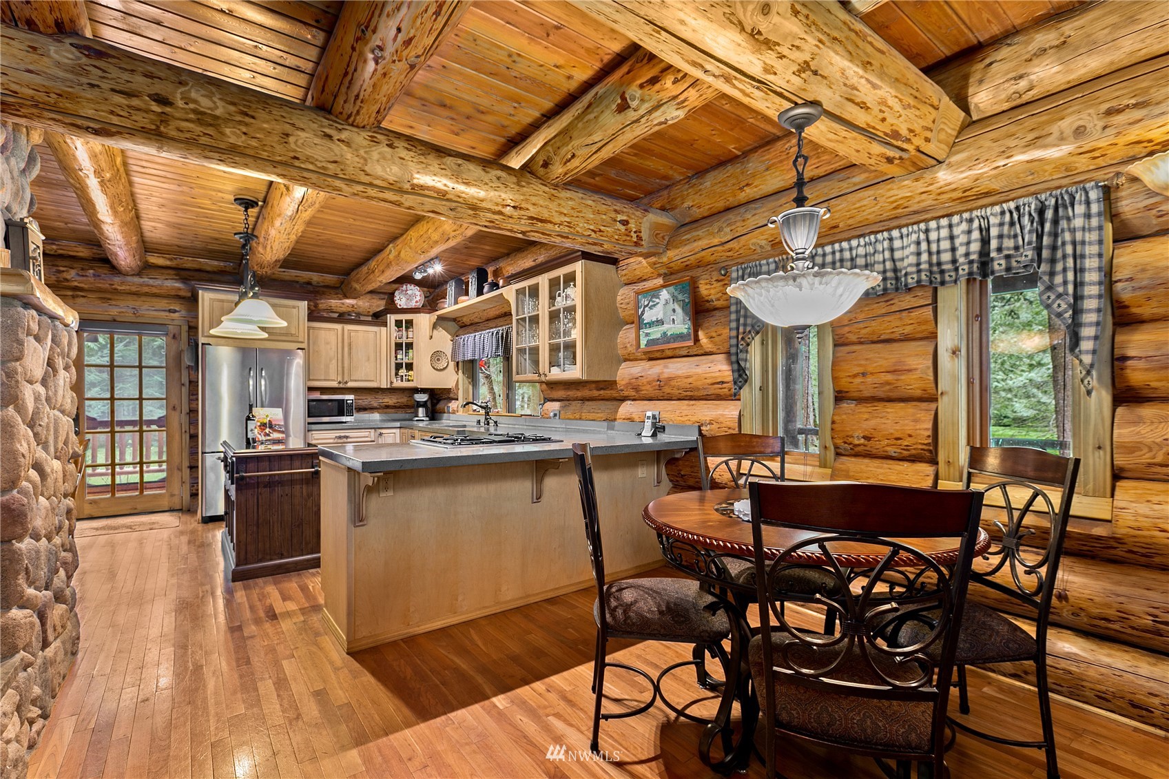 9455 Heady Road Sumas, WA 98295 - Photo 13 of 39 a view of a dining room with furniture window and wooden floor
