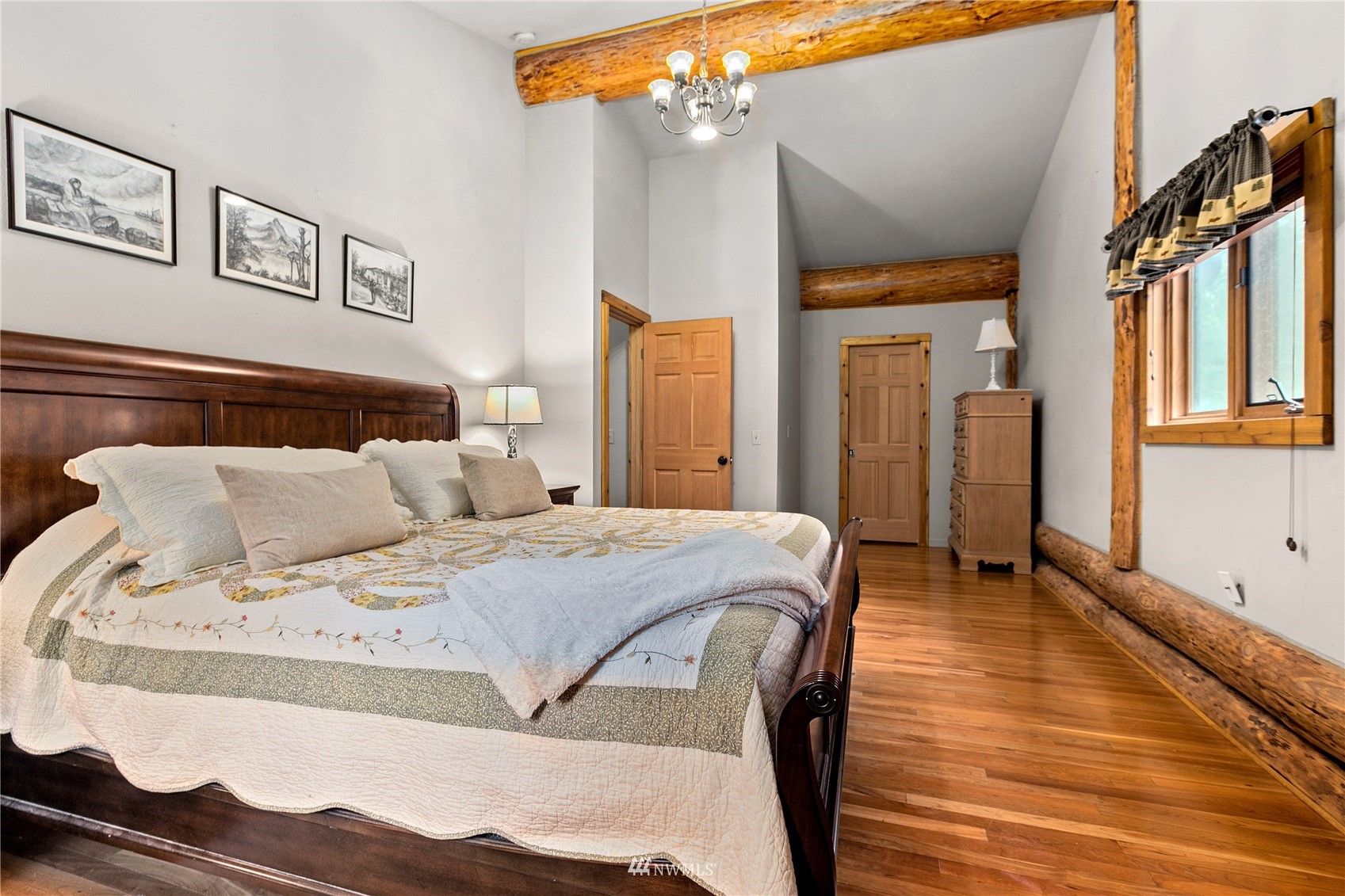 9455 Heady Road Sumas, WA 98295 - Photo 26 of 39 a spacious bedroom with a bed and wooden floor