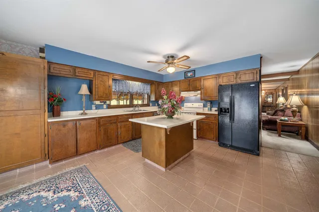 a kitchen with a stove a sink and a microwave