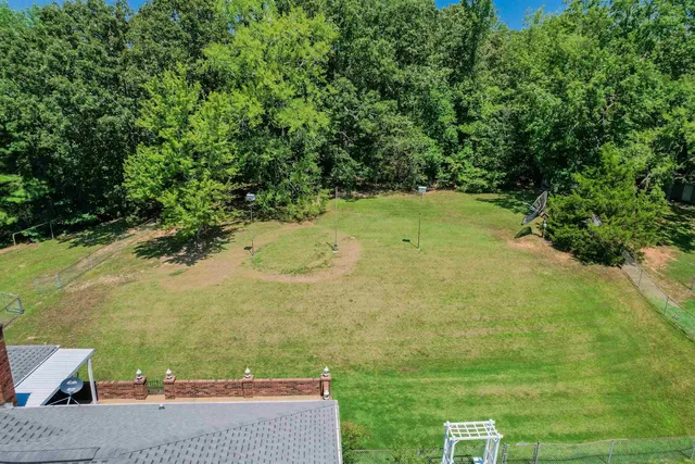 a view of a yard with an outdoor space