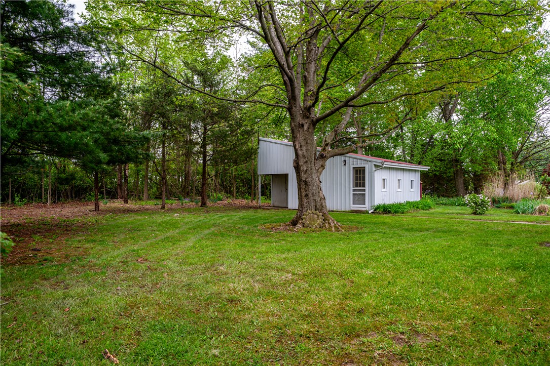 11296 Pansing Road Brookville, OH 45309 - Photo 43 of 53 This expansive lot features a verdant lawn, mature trees, and a versatile outbuilding.
