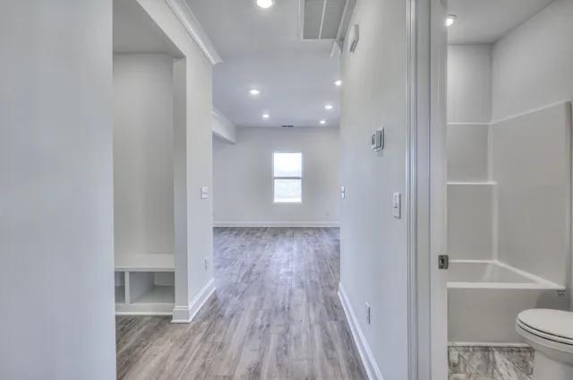 a view of entryway with wooden floor