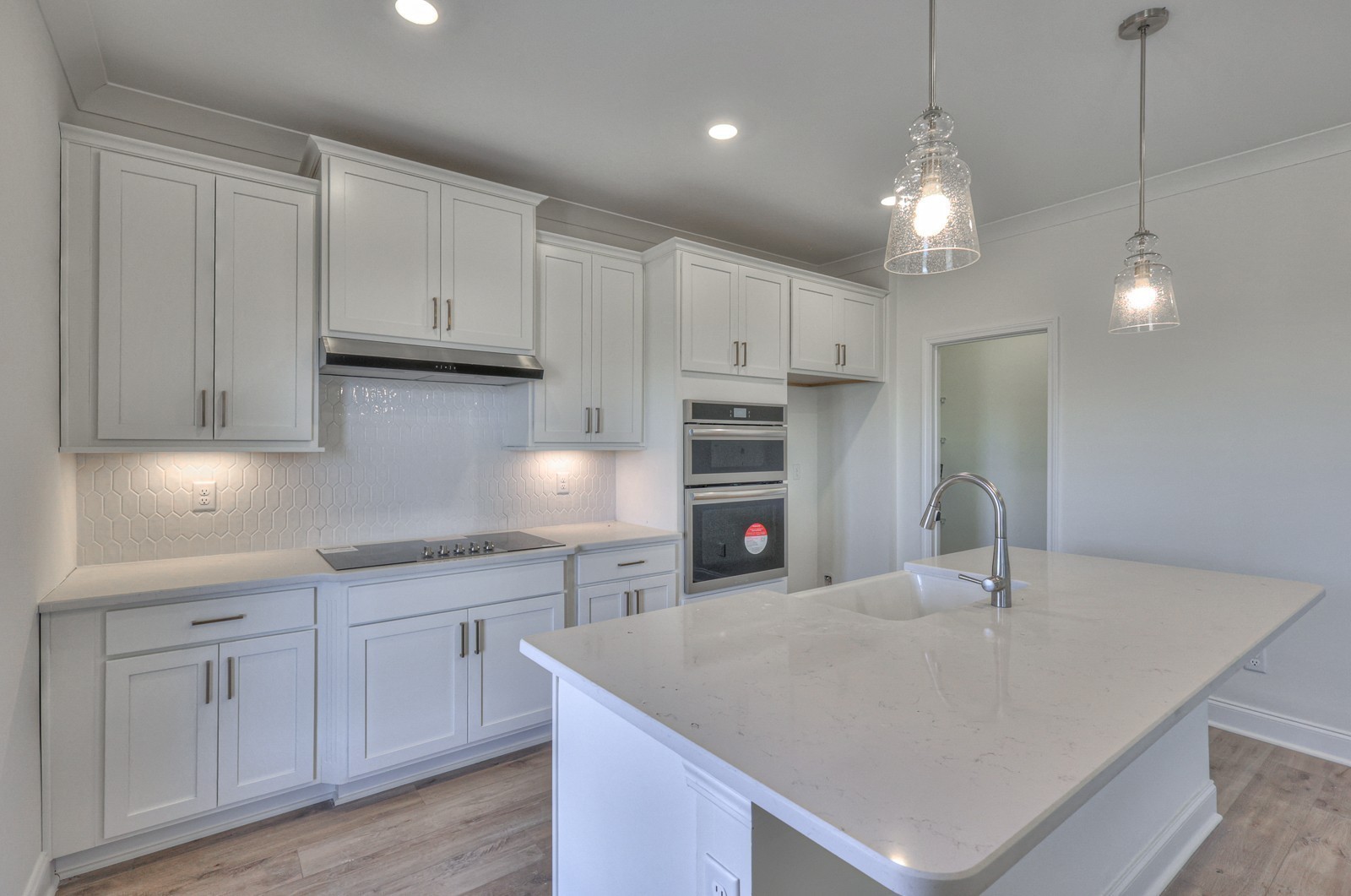 2269 Bluestem Road Columbia, TN 38401 - Photo 6 of 25 a kitchen with kitchen island a sink a center island and cabinets