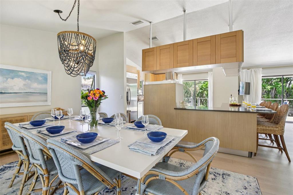 3390 Bayou Sound Longboat Key, FL 34228 - Photo 27 of 59 a view of a dining room with furniture window and outside view