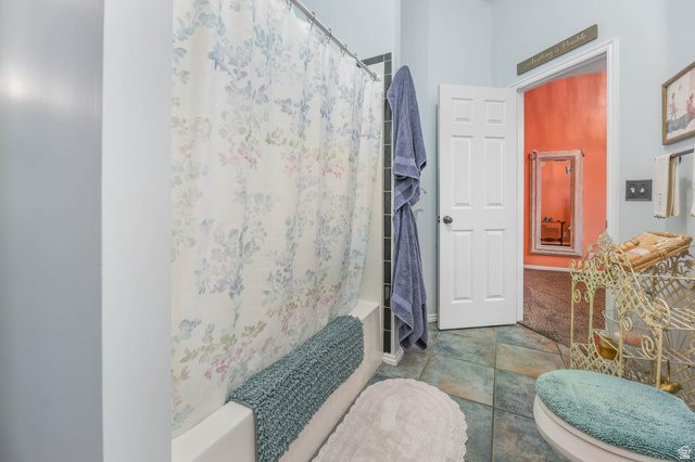 569 Elk Meadow Loop Tooele, UT 84074 - Photo 42 of 56 Full bathroom featuring shower / bathtub combination with curtain and tile patterned flooring