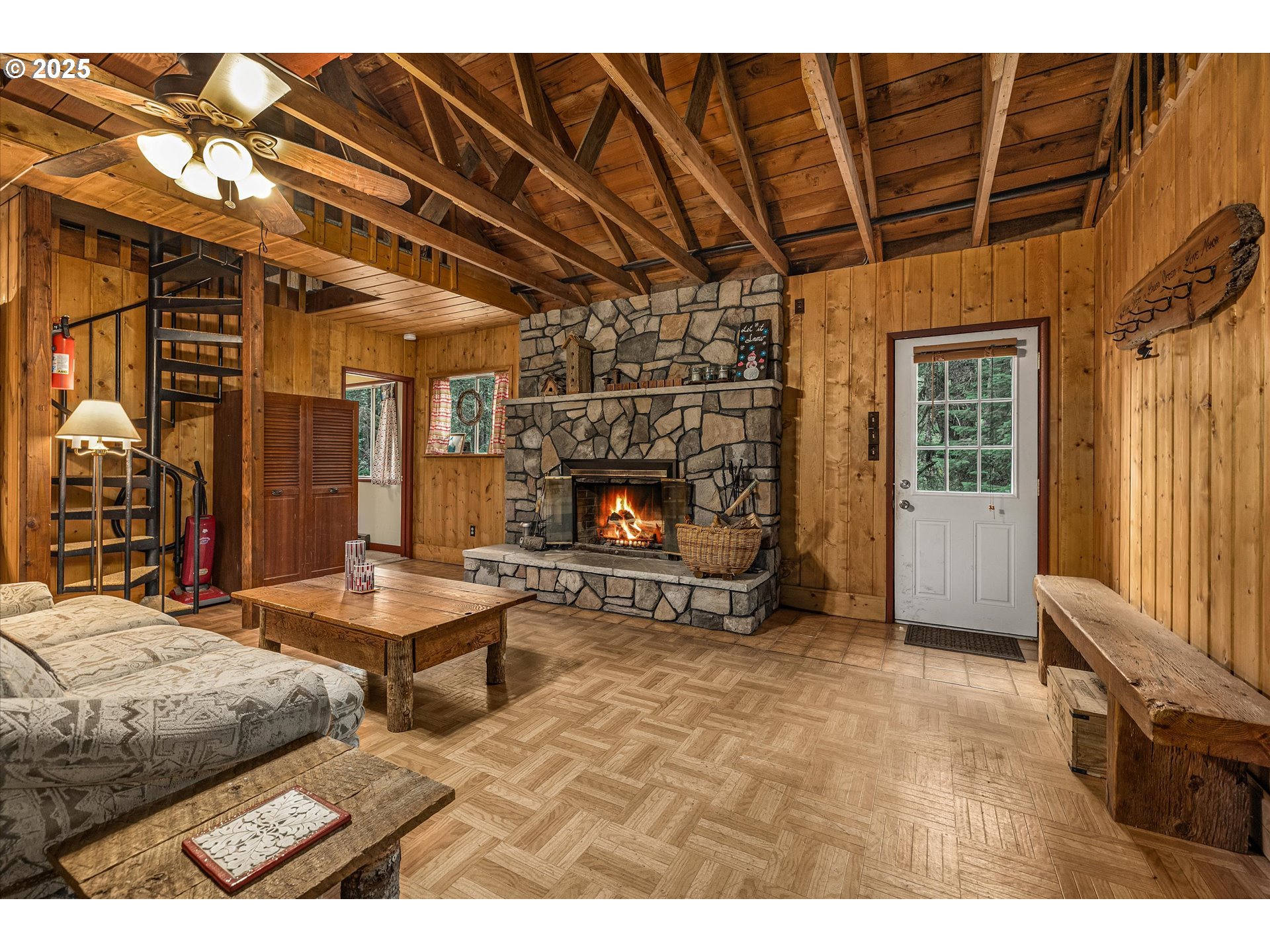 75125 Mt Hood Highway Rhododendron, OR 97049 - Photo 13 of 43 a living room with furniture a fireplace and a table