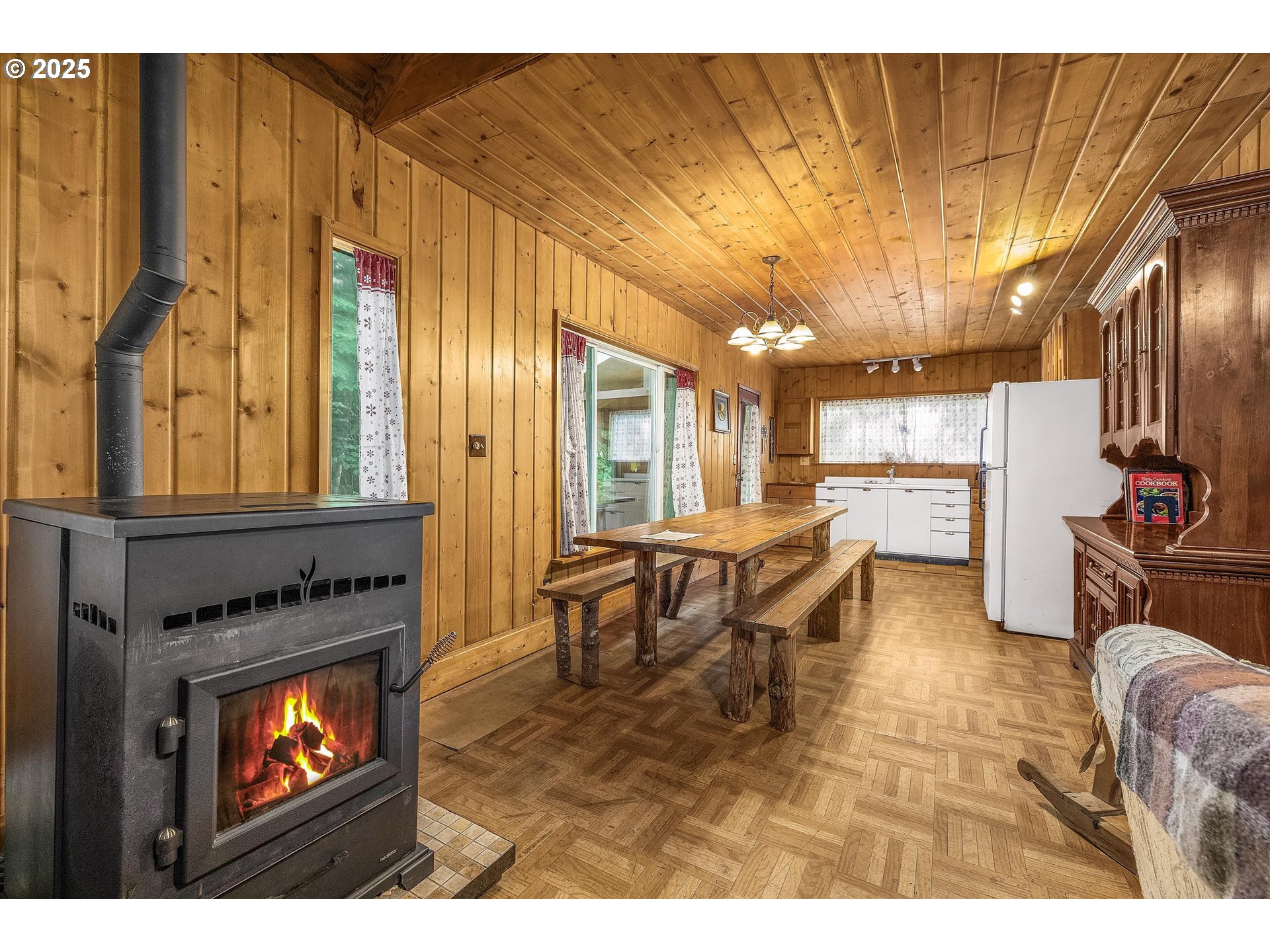 75125 Mt Hood Highway Rhododendron, OR 97049 - Photo 16 of 43 a living room with furniture a flat screen tv and kitchen view