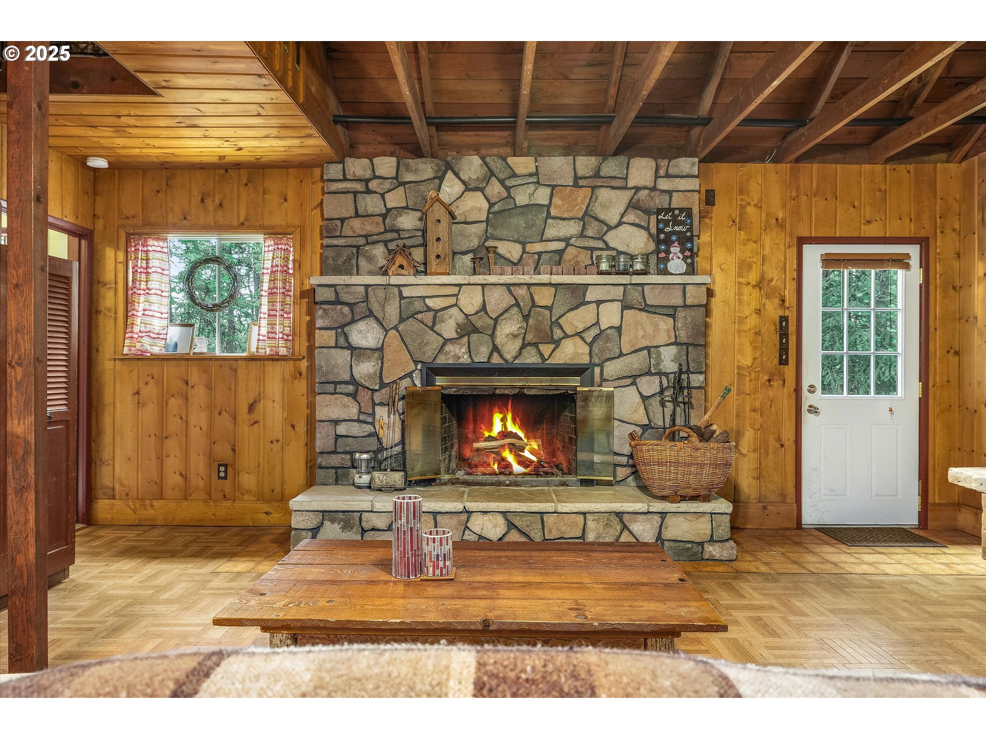 75125 Mt Hood Highway Rhododendron, OR 97049 - Photo 19 of 43 a living room with a couch and a fireplace