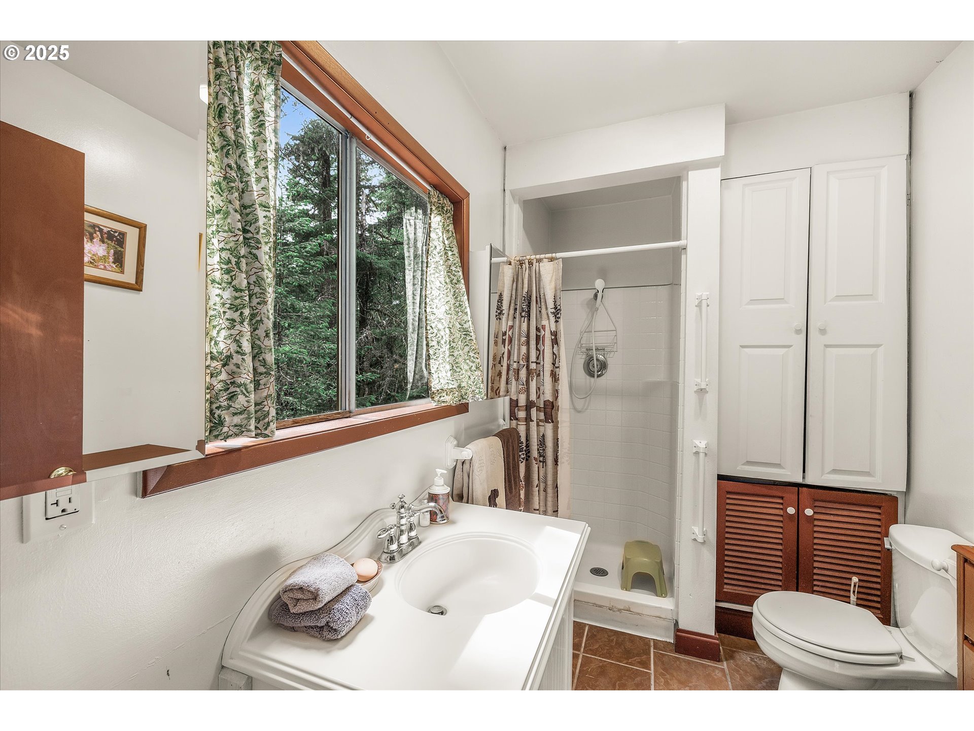 75125 Mt Hood Highway Rhododendron, OR 97049 - Photo 24 of 43 a bathroom with a sink and a mirror