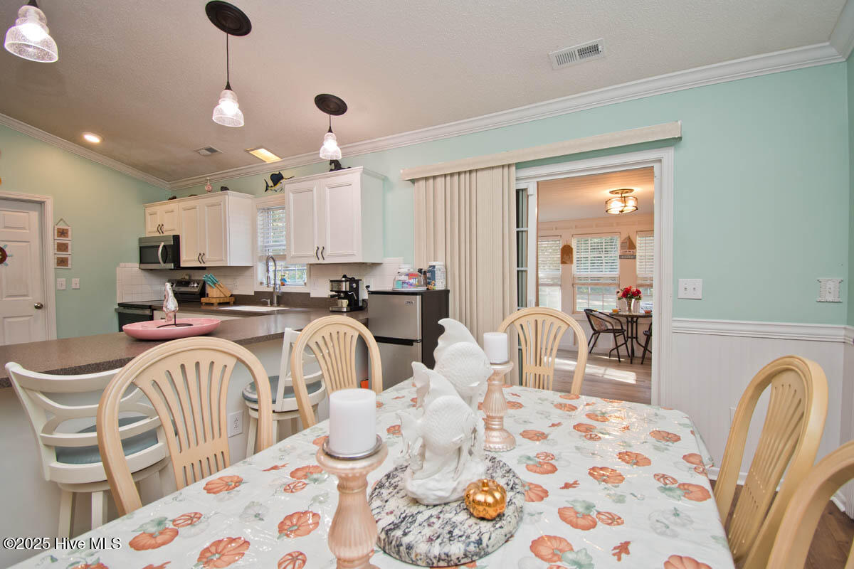 243 Barrington Ridge Bogue, NC 28570 - Photo 13 of 29 Sunroom off Dining Room