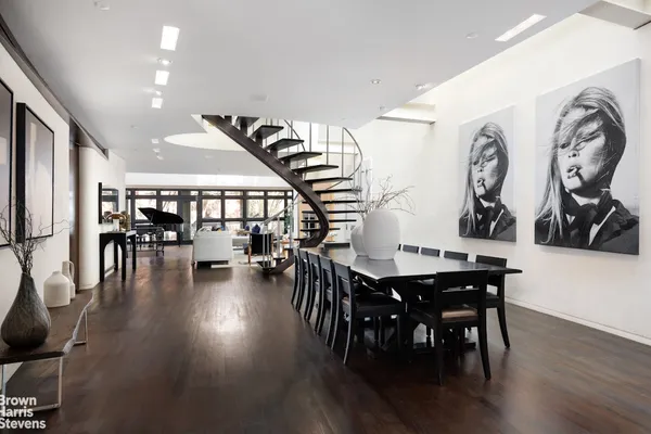 a dining room with furniture and wooden floor