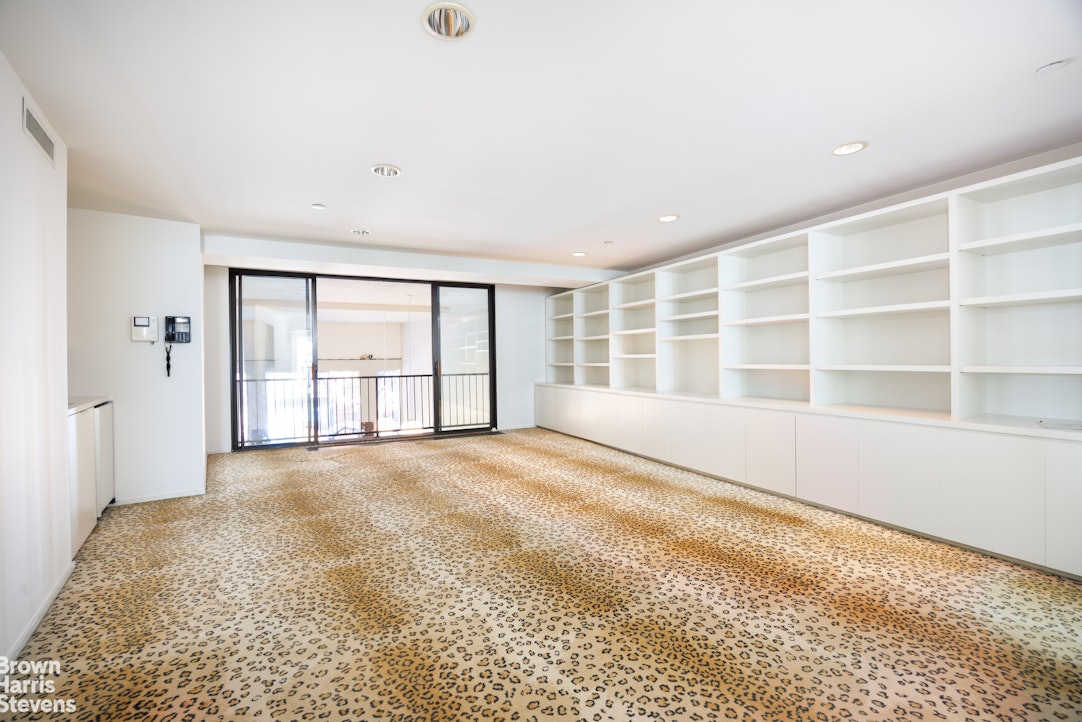 42 Downing Street Manhattan, NY 10014 - Photo 20 of 25 a view of an empty room with a window
