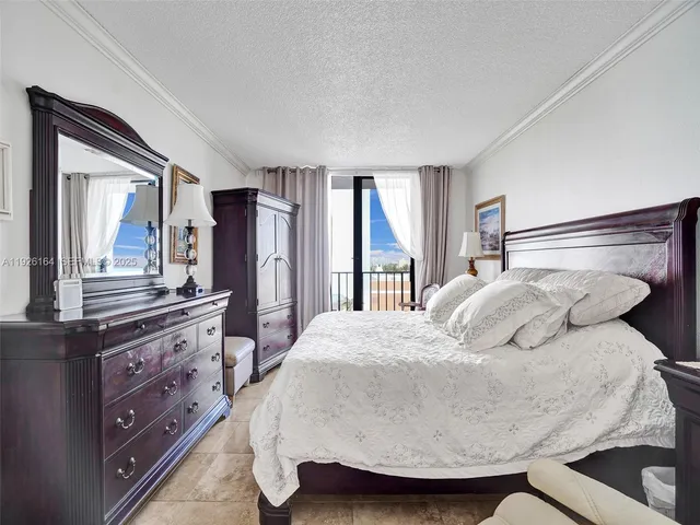 a bathroom with a granite countertop toilet sink and mirror
