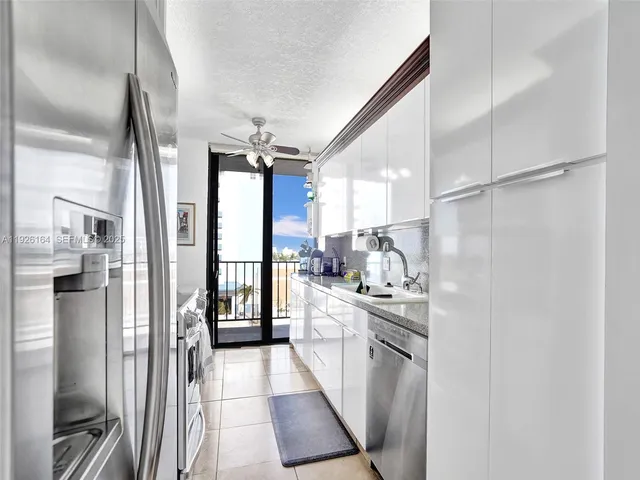 a kitchen with stainless steel appliances granite countertop a sink and stove
