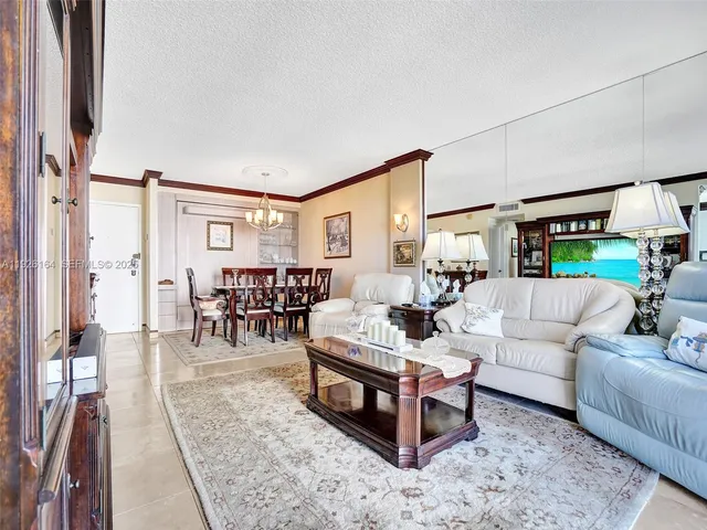 a view of a livingroom with furniture and window
