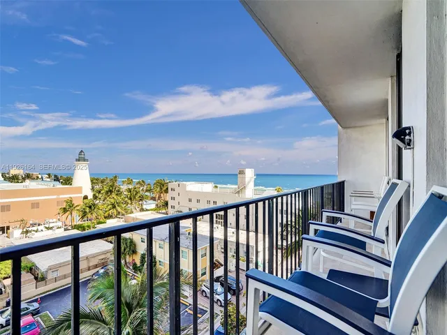 a work room with gym equipment and large windows
