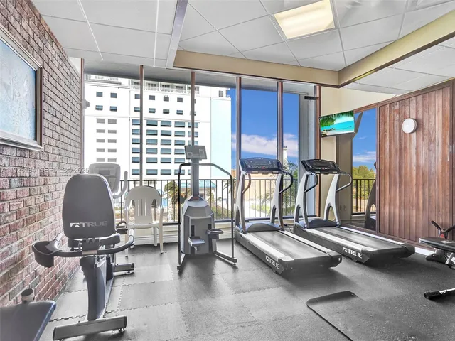 a view of swimming pool with outdoor seating and city view