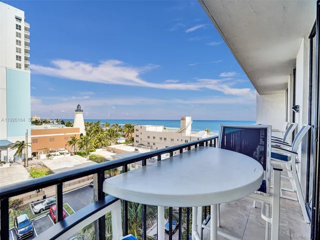 a bedroom with a bed window and dresser