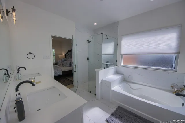 a bathroom with a tub sink and toilet