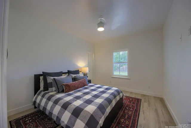 a bedroom with a bed and window