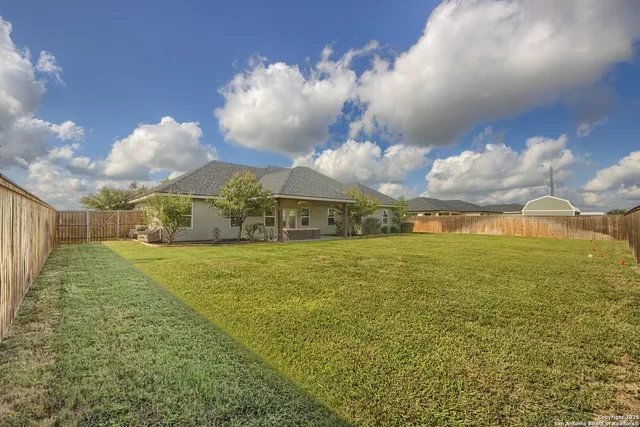 a view of a big yard with an empty space
